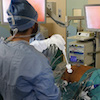 A surgeon viewed from the back